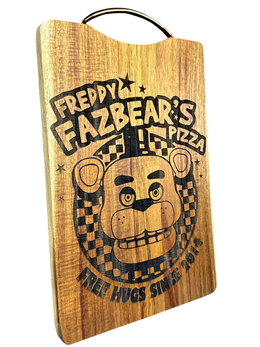 Angled view of Freddy Fazbear's Pizza engraved acacia cutting board