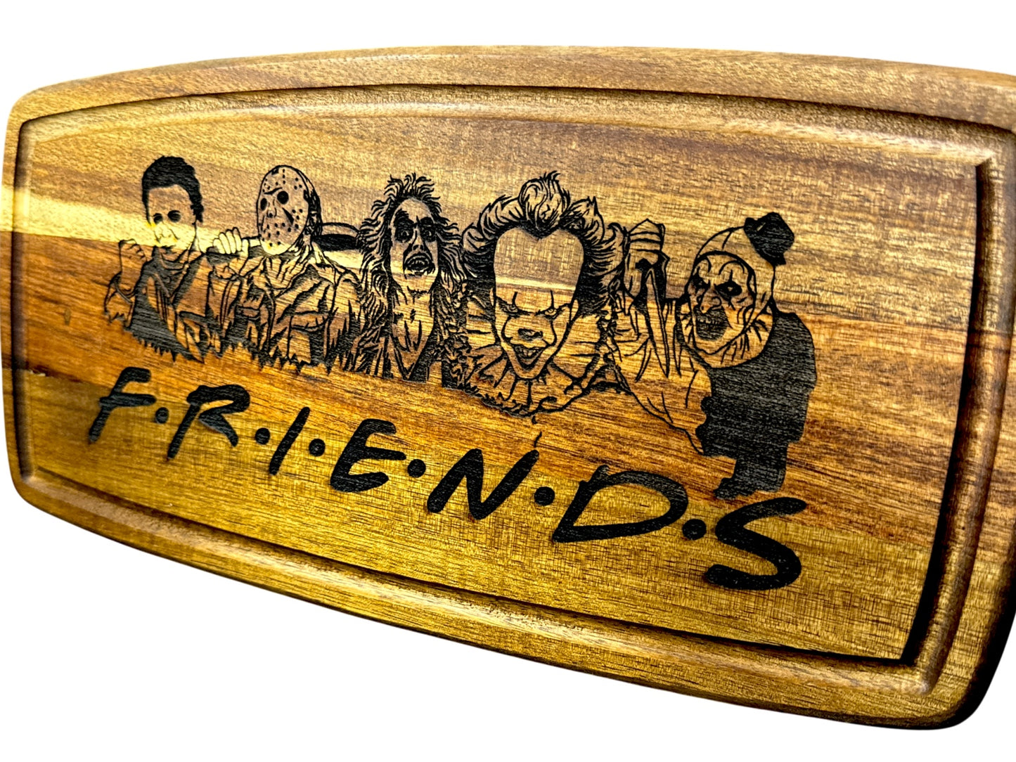 Second angled view of Horror Friends engraved acacia cutting board