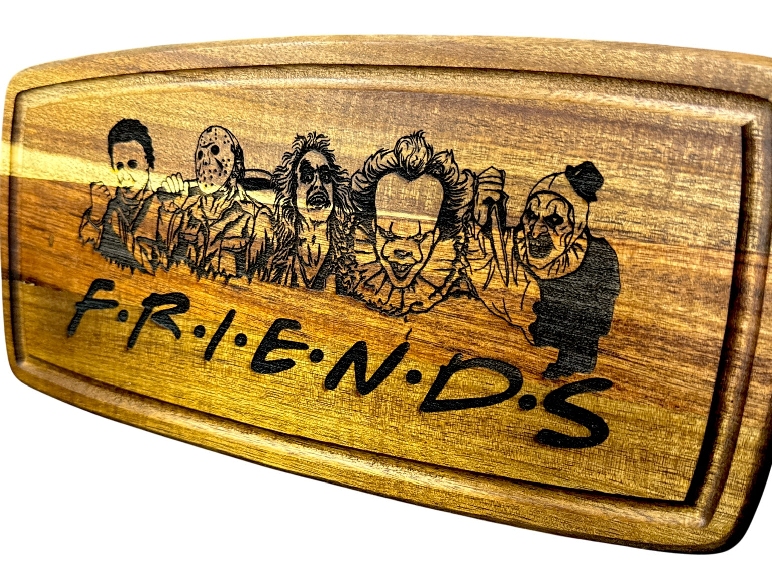 Second angled view of Horror Friends engraved acacia cutting board