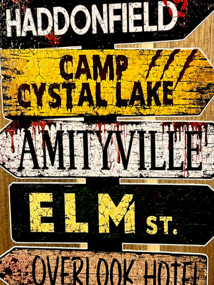Close up of UV printed horror movie street signs on acacia board