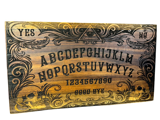 Laser engraved Ouija inspired spirit board made from finished walnut slab