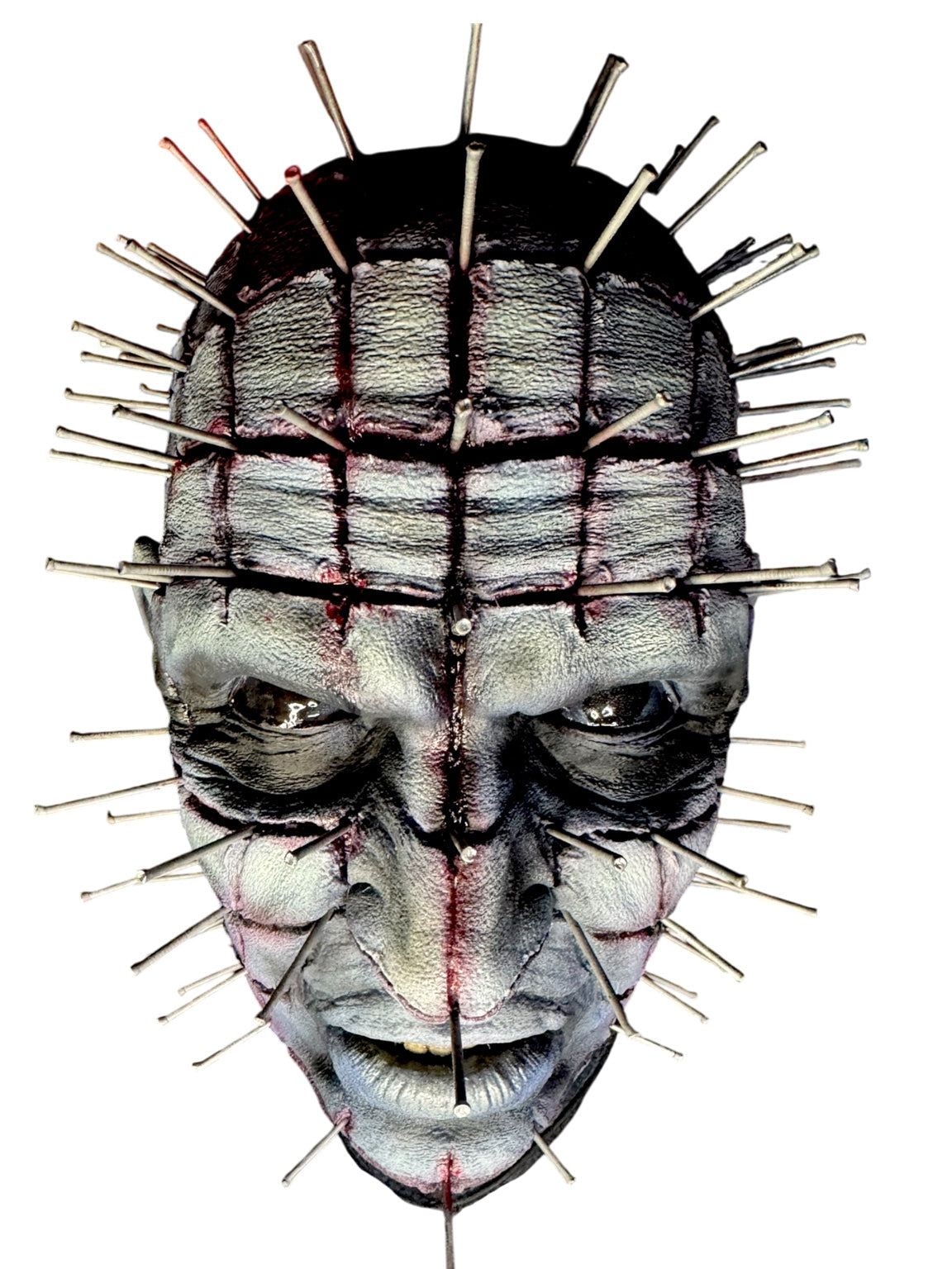 Front view of hand-painted Pinhead horror bust with pin details