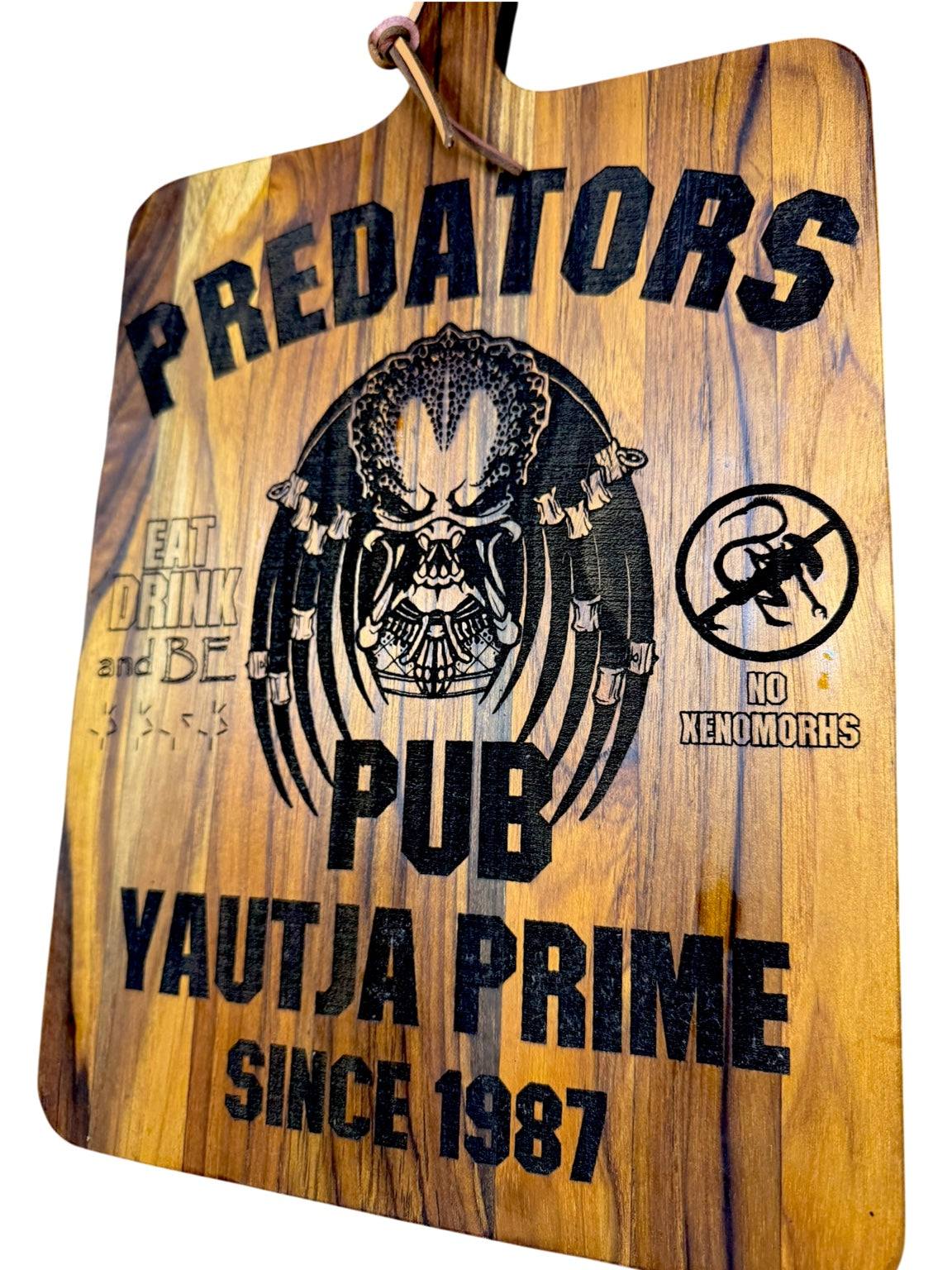 Side angle of Predators Pub Yautja Prime engraved wood board