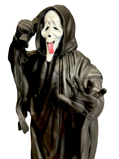 Close view of Scary Movie inspired GhostFace hand-painted statue with tongue mask and phone
